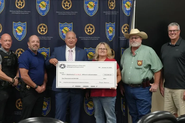 Donnie Anderson presents OBN check to Oklahoma D.A.R.E. officers association